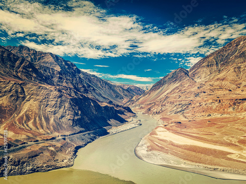 Vintage retro effect filtered hipster style image of confluence of Indus and Zanskar rivers in Himalayas. Indus valley, Ladakh, India photo