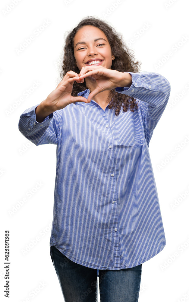 Young hispanic business woman smiling in love showing heart symbol and shape with hands. Romantic concept. Young hispanic business woman smiling in love showing heart symbol and shape with hands. Romantic concept.