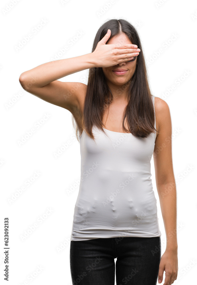 Young beautiful hispanic wearing sunglasses smiling and laughing with hand on face covering eyes for surprise. Blind concept. Young beautiful hispanic wearing sunglasses smiling and laughing with hand on face covering eyes for surprise. Blind concept.