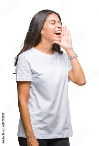 Young beautiful arab woman over isolated background shouting and screaming loud to side with hand on mouth. Communication concept.