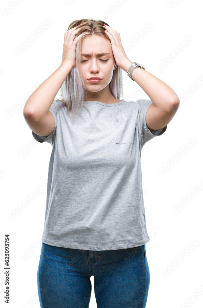 Young blonde woman over isolated background suffering from headache desperate and stressed because pain and migraine. Hands on head. Young blonde woman over isolated background suffering from headache desperate and stressed because pain and migraine. Hands on head.