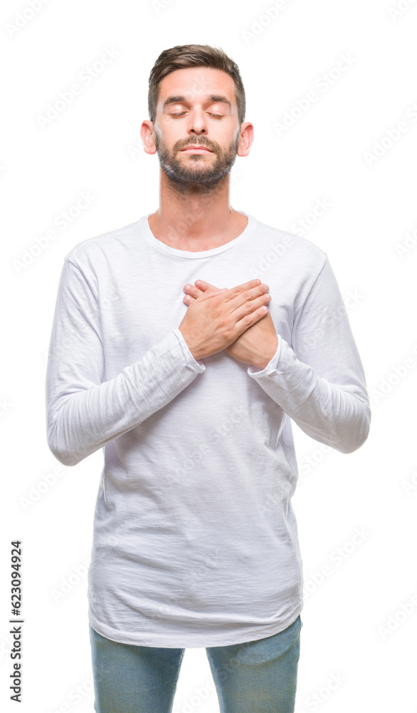 Young handsome man over isolated background smiling with hands on chest with closed eyes and grateful gesture on face. Health concept. Young handsome man over isolated background smiling with hands on chest with closed eyes and grateful gesture on face. Health concept.