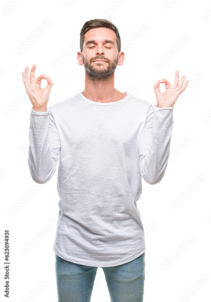 Young handsome man over isolated background relax and smiling with eyes closed doing meditation gesture with fingers. Yoga concept. Young handsome man over isolated background relax and smiling with eyes closed doing meditation gesture with fingers. Yoga concept.