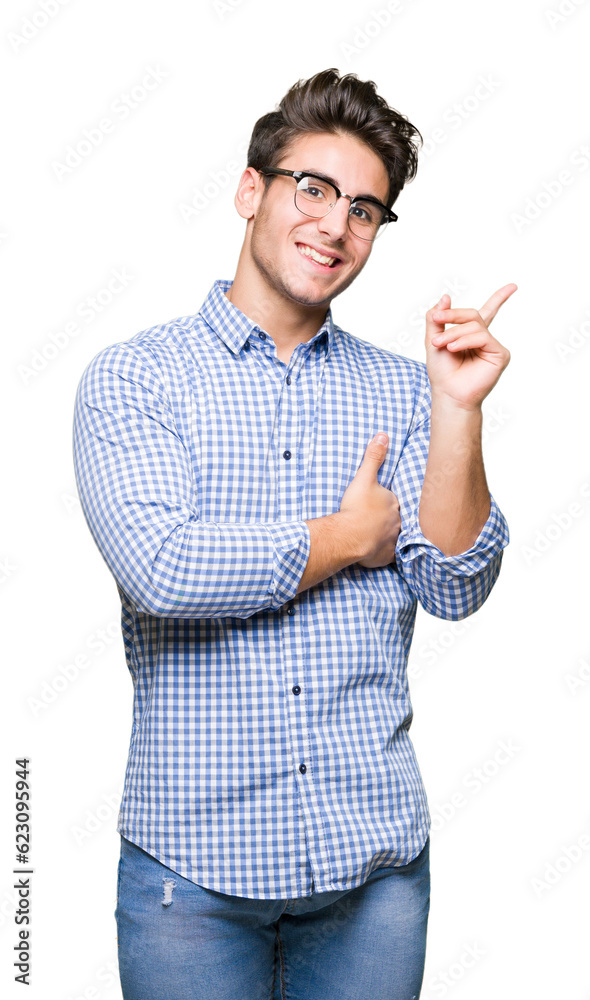 Young handsome man wearing glasses over isolated background with a big smile on face, pointing with hand and finger to the side looking at the camera. Young handsome man wearing glasses over isolated background with a big smile on face, pointing with hand and finger to the side looking at the camera.