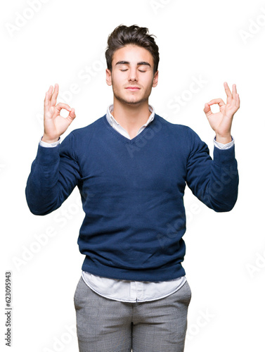 Young handsome business man over isolated background relax and smiling with eyes closed doing meditation gesture with fingers. Yoga concept.