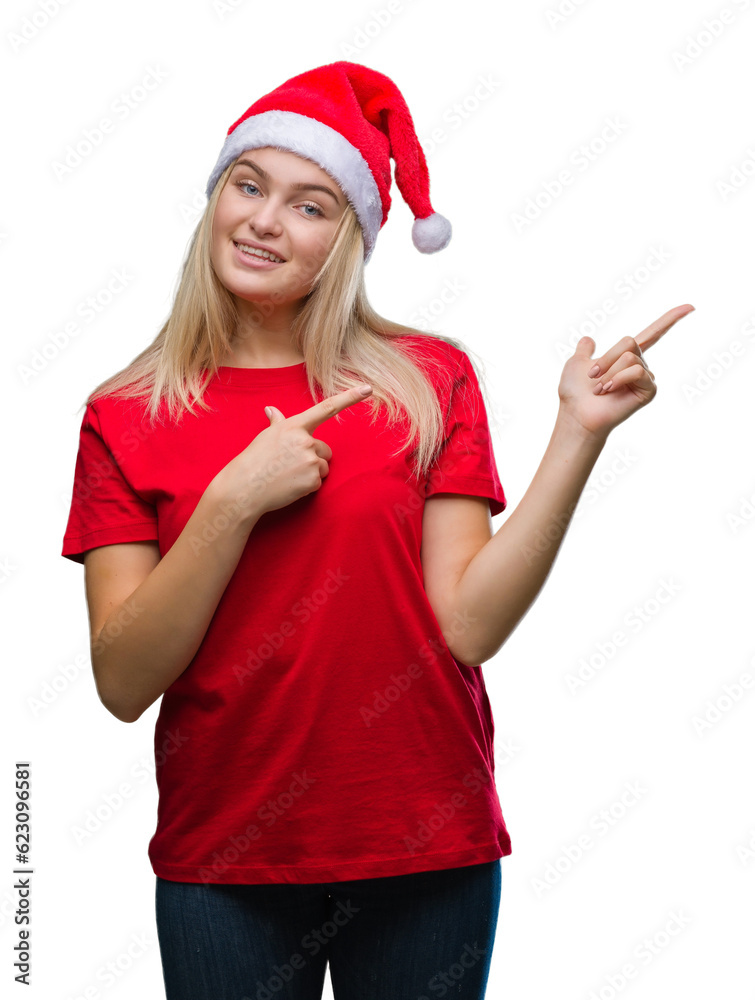 Young caucasian woman wearing christmas hat over isolated background smiling and looking at the camera pointing with two hands and fingers to the side. Young caucasian woman wearing christmas hat over isolated background smiling and looking at the camera pointing with two hands and fingers to the side.