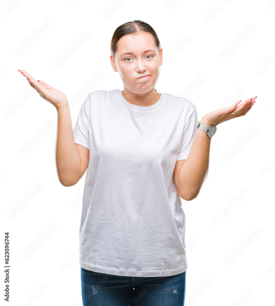Young beautiful caucasian woman over isolated background clueless and confused expression with arms and hands raised. Doubt concept. Young beautiful caucasian woman over isolated background clueless and confused expression with arms and hands raised. Doubt concept.