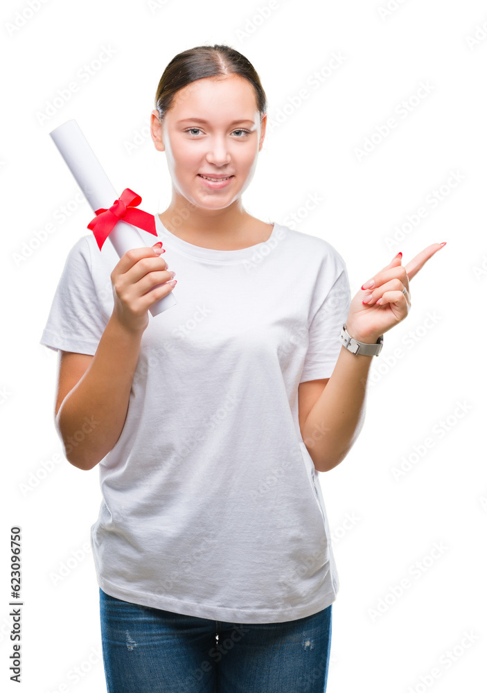 Young caucasian woman holding degree over isolated background very happy pointing with hand and finger to the side Young caucasian woman holding degree over isolated background very happy pointing with hand and finger to the side