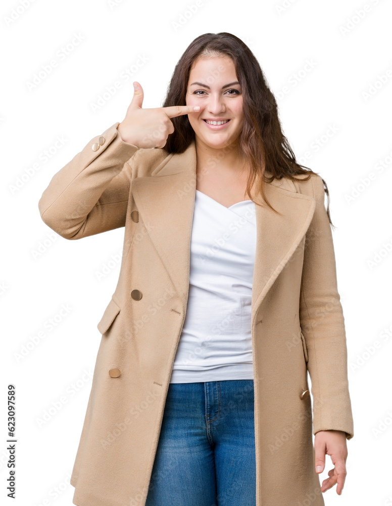 Beautiful plus size young woman wearing winter coat over isolated background Pointing with hand finger to face and nose, smiling cheerful Beautiful plus size young woman wearing winter coat over isolated background Pointing with hand finger to face and nose, smiling cheerful