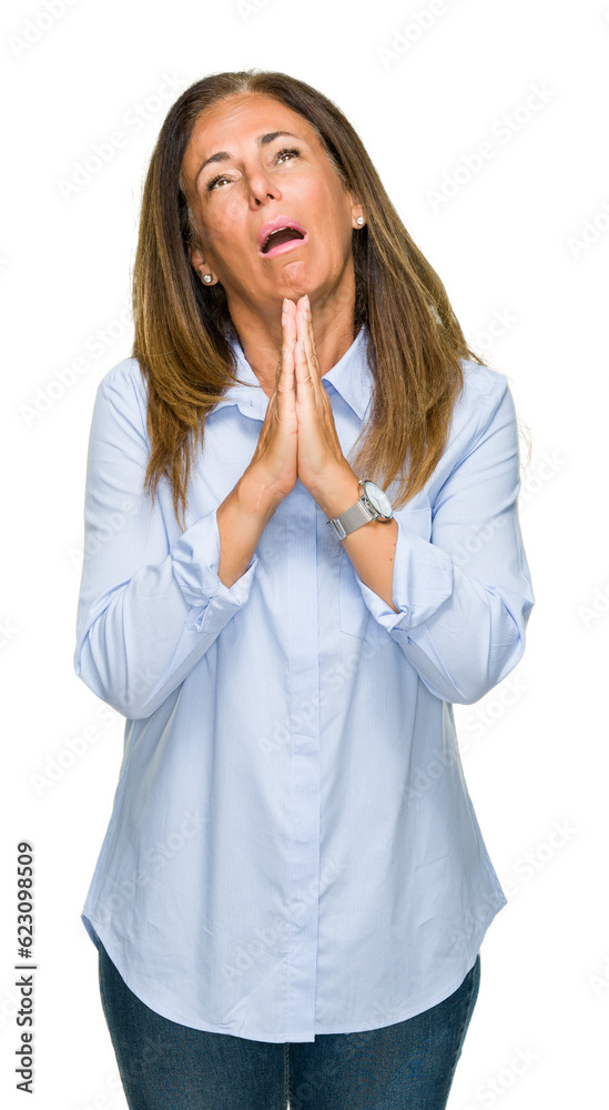 Beautiful middle age business adult woman over isolated background begging and praying with hands together with hope expression on face very emotional and worried. Asking for forgiveness Beautiful middle age business adult woman over isolated background begging and praying with hands together with hope expression on face very emotional and worried. Asking for forgiveness