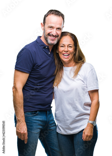 Fotografie Middle age hispanic casual couple over isolated background with a happy and cool smile on face