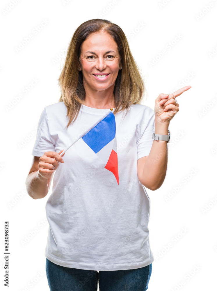 Middle age hispanic woman holding flag of France over isolated background very happy pointing with hand and finger to the side Middle age hispanic woman holding flag of France over isolated background very happy pointing with hand and finger to the side