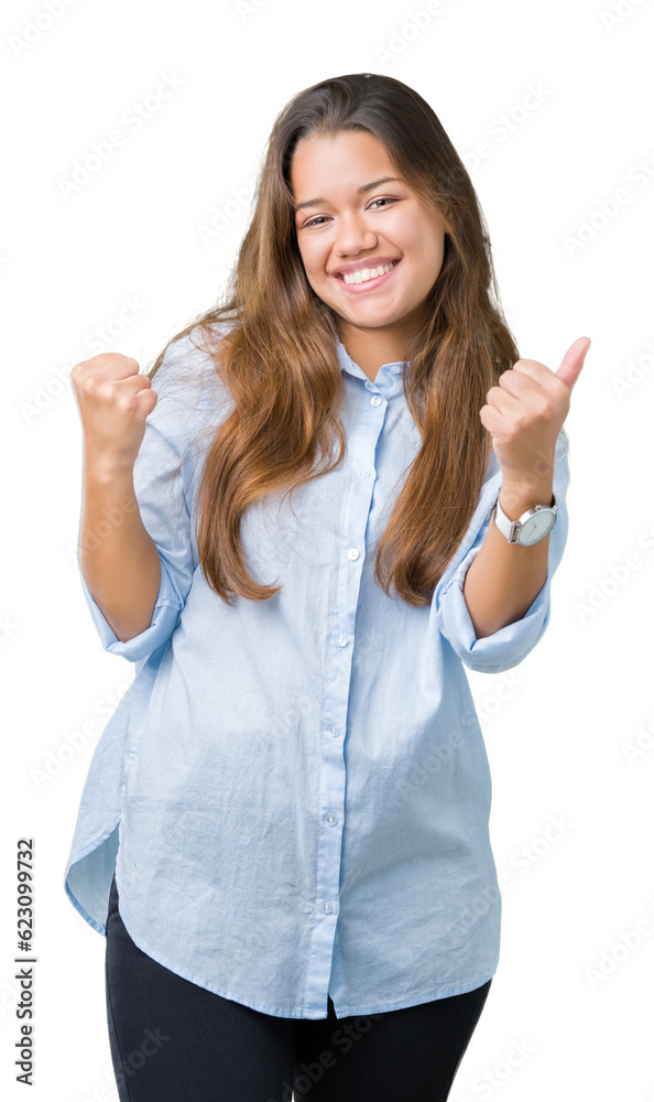 Young beautiful brunette business woman over isolated background very happy and excited doing winner gesture with arms raised, smiling and screaming for success. Celebration concept. Young beautiful brunette business woman over isolated background very happy and excited doing winner gesture with arms raised, smiling and screaming for success. Celebration concept.