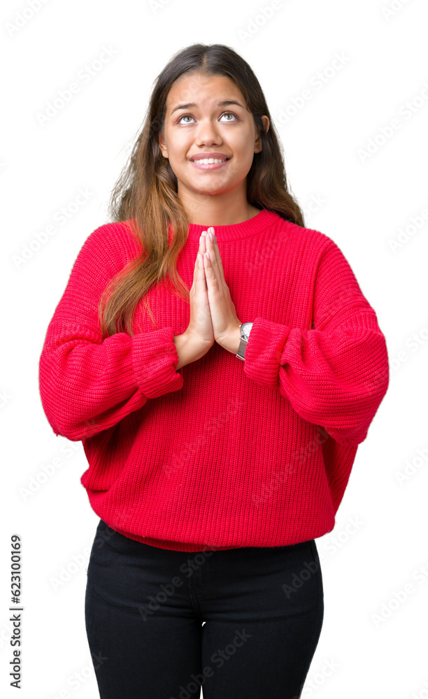 Young beautiful brunette woman wearing red winter sweater over isolated background begging and praying with hands together with hope expression on face very emotional and worried. Asking Young beautiful brunette woman wearing red winter sweater over isolated background begging and praying with hands together with hope expression on face very emotional and worried. Asking