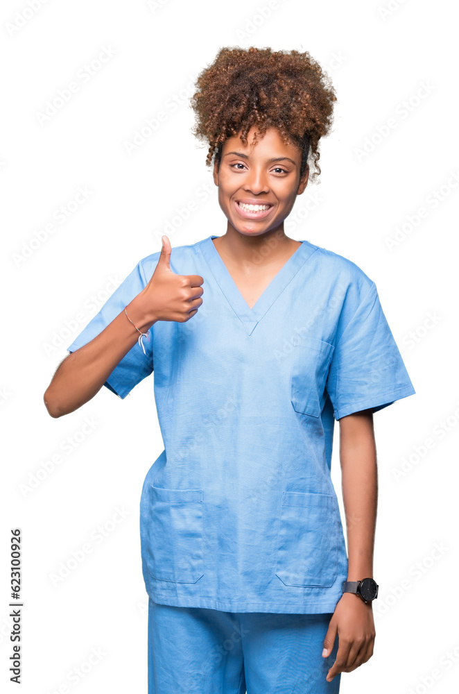 Young african american doctor woman over isolated background doing happy thumbs up gesture with hand. Approving expression looking at the camera with showing success. Young african american doctor woman over isolated background doing happy thumbs up gesture with hand. Approving expression looking at the camera with showing success.