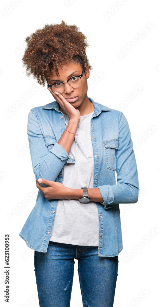 Beautiful young african american woman wearing glasses over isolated background thinking looking tired and bored with depression problems with crossed arms. Beautiful young african american woman wearing glasses over isolated background thinking looking tired and bored with depression problems with crossed arms.