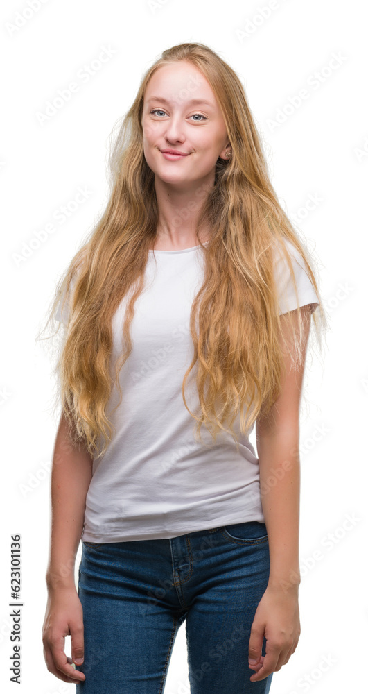 Blonde teenager woman with a happy face standing and smiling with a confident smile showing teeth Blonde teenager woman with a happy face standing and smiling with a confident smile showing teeth