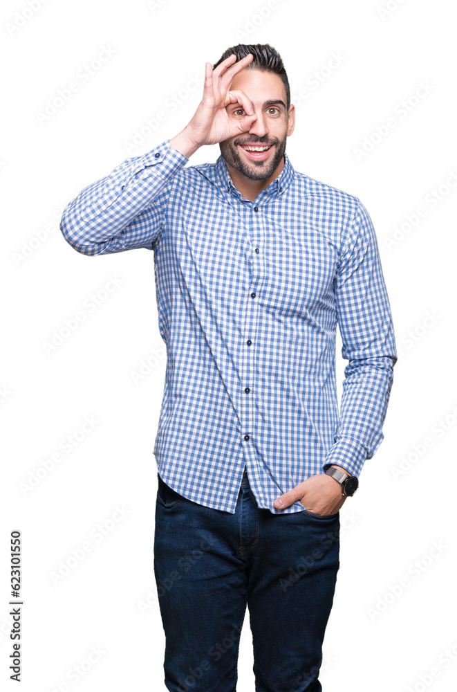 Young handsome man over isolated background doing ok gesture with hand smiling, eye looking through fingers with happy face. Young handsome man over isolated background doing ok gesture with hand smiling, eye looking through fingers with happy face.