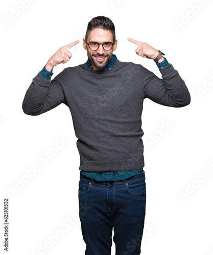Young handsome man wearing glasses over isolated background Smiling pointing to head with both hands finger, great idea or thought, good memory