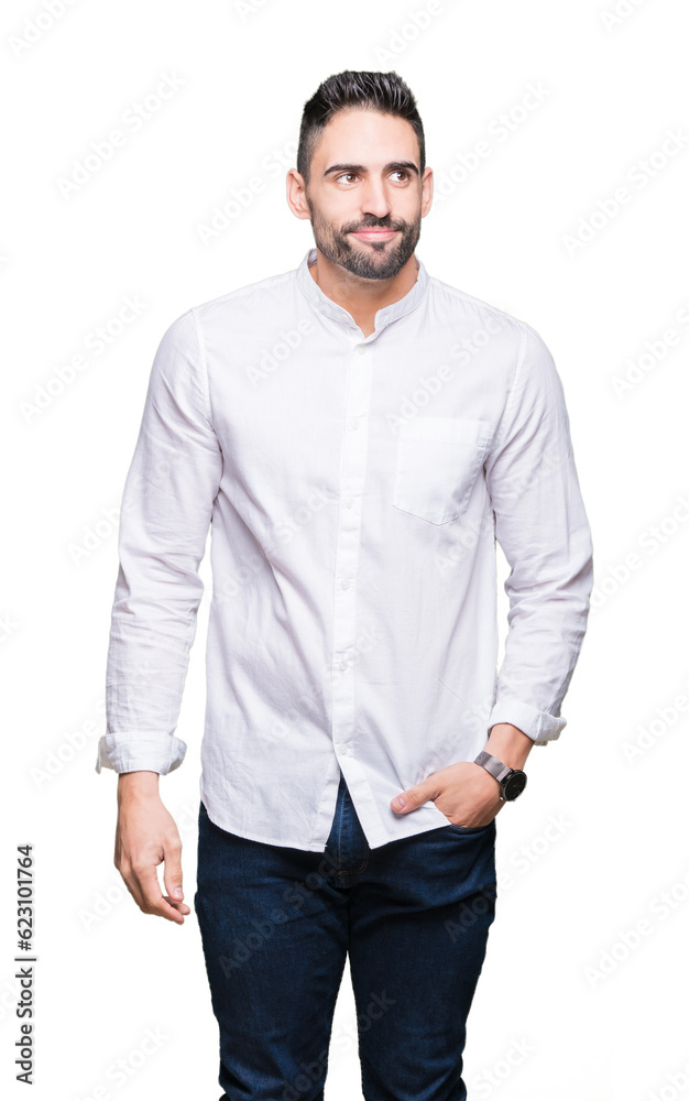 Fototapeta premium Young business man over isolated background smiling looking side and staring away thinking.