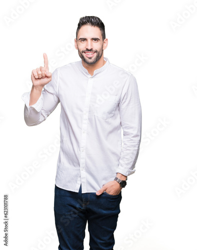 Young business man over isolated background showing and pointing up with finger number one while smiling confident and happy.