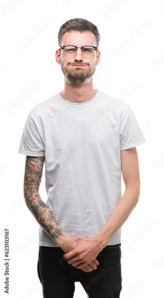 Young tattooed adult man puffing cheeks with funny face. Mouth inflated with air, crazy expression. Young tattooed adult man puffing cheeks with funny face. Mouth inflated with air, crazy expression.