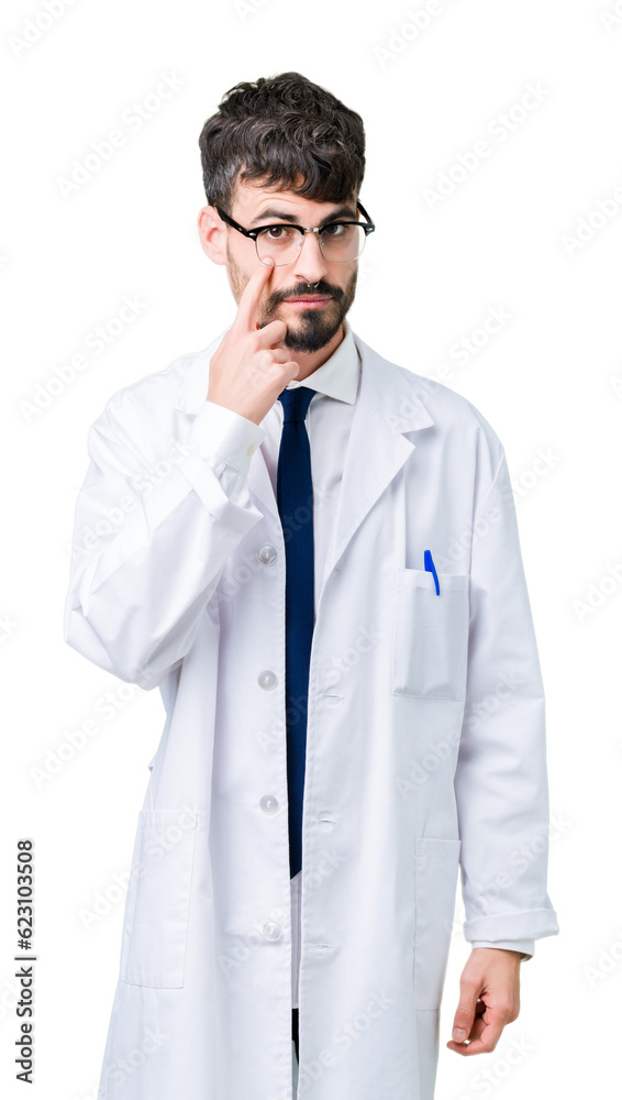 Young professional scientist man wearing white coat over isolated background Pointing to the eye watching you gesture, suspicious expression Young professional scientist man wearing white coat over isolated background Pointing to the eye watching you gesture, suspicious expression
