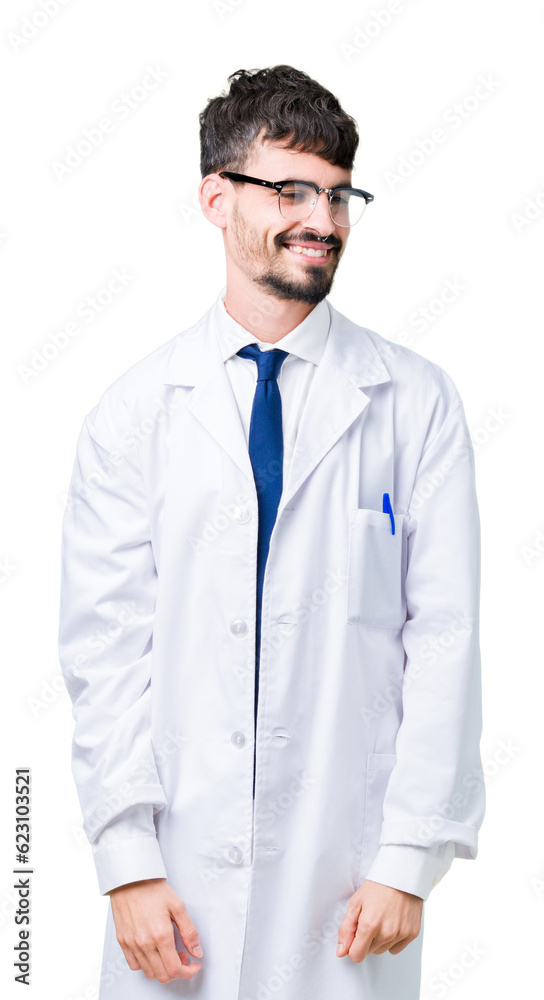Young professional scientist man wearing white coat over isolated background looking away to side with smile on face, natural expression. Laughing confident. Young professional scientist man wearing white coat over isolated background looking away to side with smile on face, natural expression. Laughing confident.