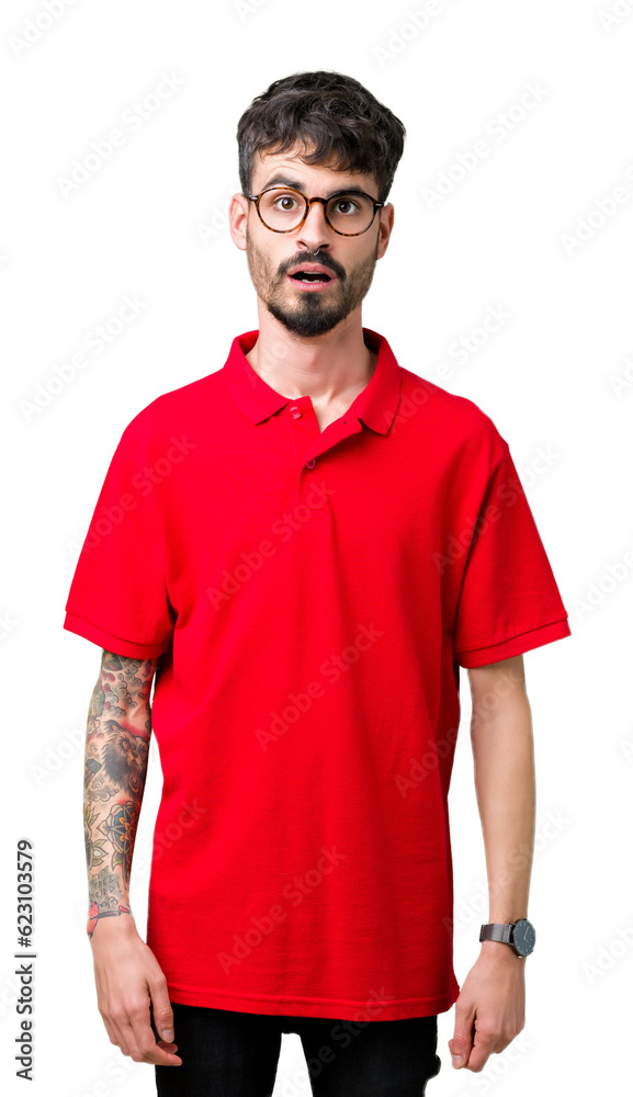 Fototapeta premium Young handsome man wearing glasses over isolated background afraid and shocked with surprise expression, fear and excited face.