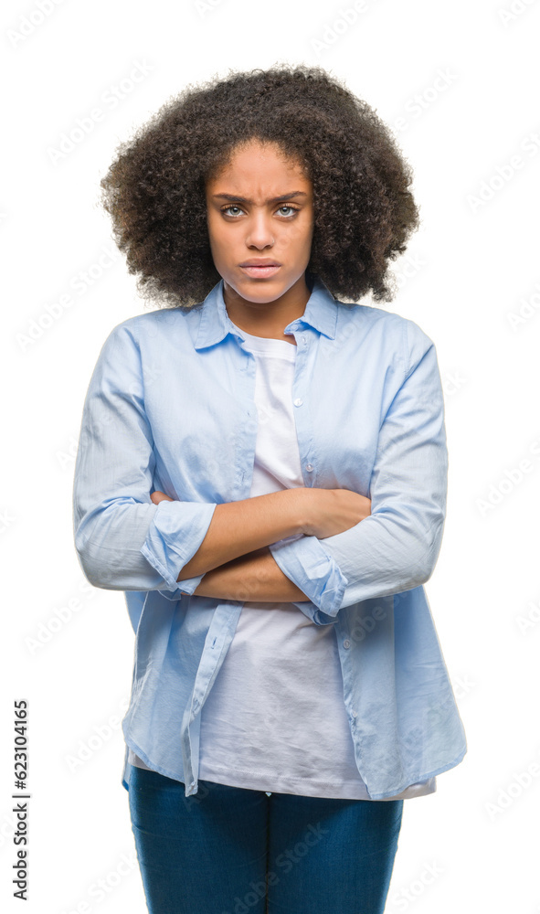 Young afro american woman over isolated background skeptic and nervous, disapproving expression on face with crossed arms. Negative person. Young afro american woman over isolated background skeptic and nervous, disapproving expression on face with crossed arms. Negative person.