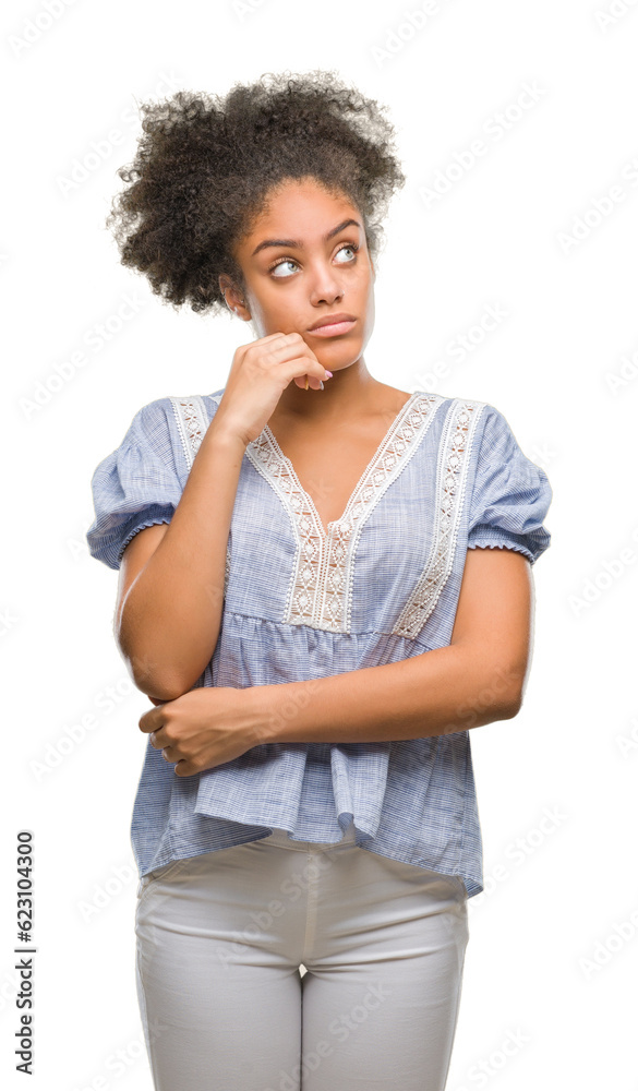 Young afro american woman over isolated background with hand on chin thinking about question, pensive expression. Smiling with thoughtful face. Doubt concept. Young afro american woman over isolated background with hand on chin thinking about question, pensive expression. Smiling with thoughtful face. Doubt concept.