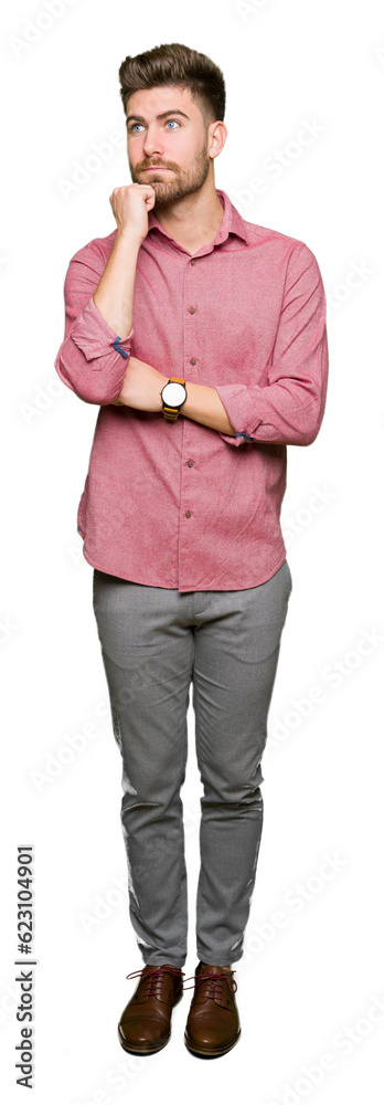 Young handsome business casual man with hand on chin thinking about question, pensive expression. Smiling with thoughtful face. Doubt concept. Young handsome business casual man with hand on chin thinking about question, pensive expression. Smiling with thoughtful face. Doubt concept.
