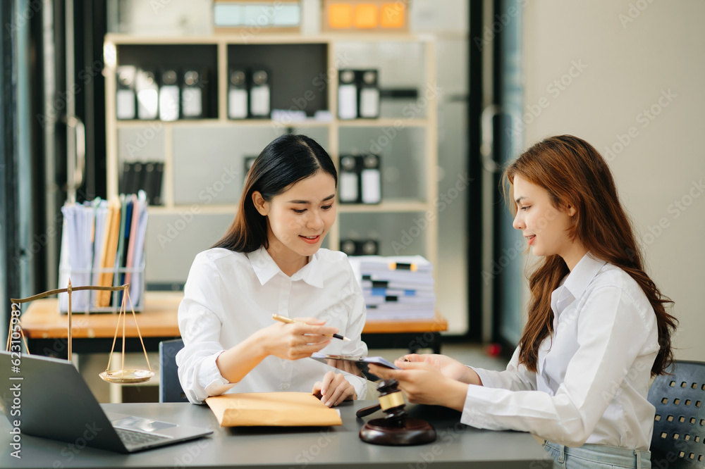Business and Female lawyer or judge consult having team meeting with client, Law and Legal services concept.Customer service good cooperation in office. Business and Female lawyer or judge consult having team meeting with client, Law and Legal services concept.Customer service good cooperation in office.