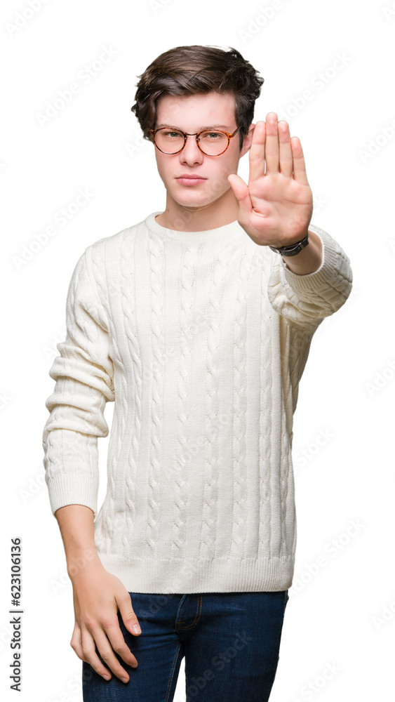 Young handsome man wearing glasses over isolated background doing stop sing with palm of the hand. Warning expression with negative and serious gesture on the face. Young handsome man wearing glasses over isolated background doing stop sing with palm of the hand. Warning expression with negative and serious gesture on the face.