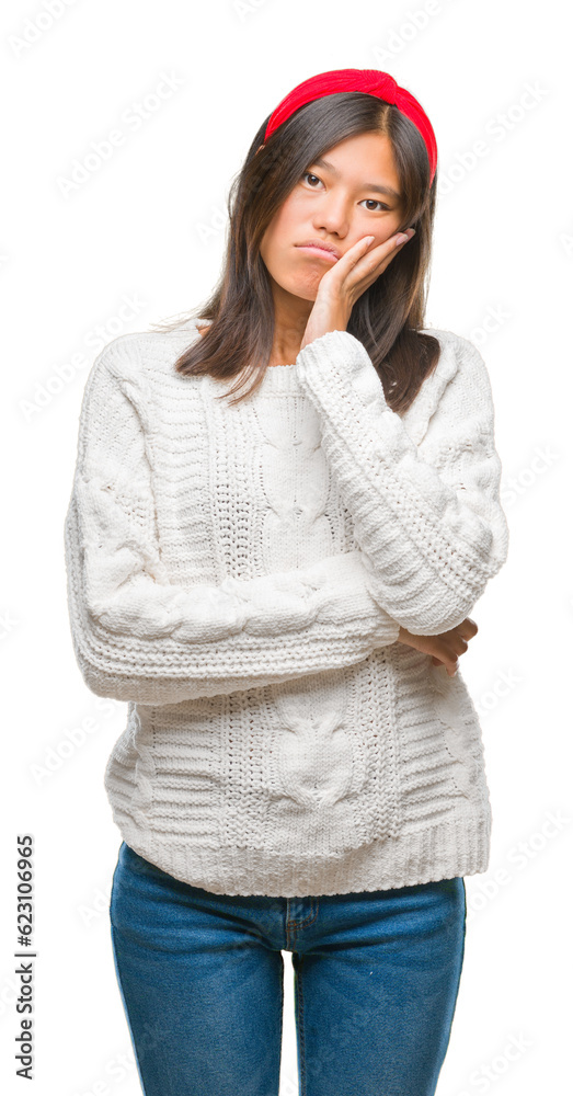 Young asian woman wearing winter sweater over isolated background thinking looking tired and bored with depression problems with crossed arms. Young asian woman wearing winter sweater over isolated background thinking looking tired and bored with depression problems with crossed arms.
