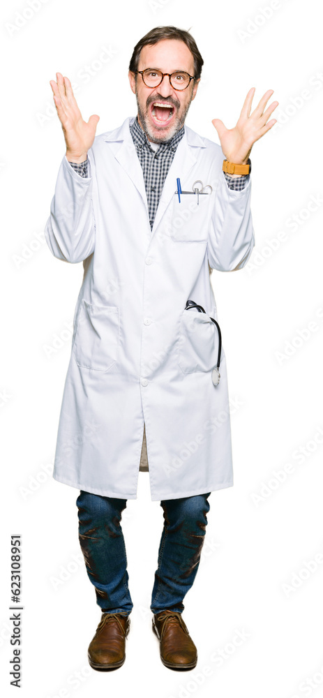 Middle age doctor men wearing medical coat celebrating crazy and amazed for success with arms raised and open eyes screaming excited. Winner concept Middle age doctor men wearing medical coat celebrating crazy and amazed for success with arms raised and open eyes screaming excited. Winner concept