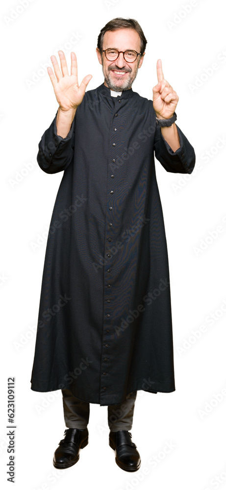 Middle age priest man wearing catholic robe showing and pointing up with fingers number six while smiling confident and happy. Middle age priest man wearing catholic robe showing and pointing up with fingers number six while smiling confident and happy.