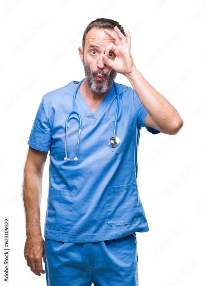 Middle age hoary senior doctor man wearing medical uniform over isolated background doing ok gesture shocked with surprised face, eye looking through fingers. Unbelieving expression. Middle age hoary senior doctor man wearing medical uniform over isolated background doing ok gesture shocked with surprised face, eye looking through fingers. Unbelieving expression.