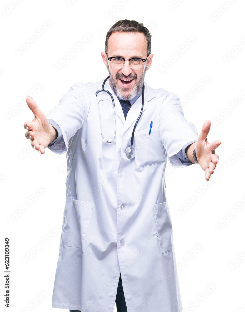 Middle age senior hoary doctor man wearing medical uniform isolated background looking at the camera smiling with open arms for hug. Cheerful expression embracing happiness. Middle age senior hoary doctor man wearing medical uniform isolated background looking at the camera smiling with open arms for hug. Cheerful expression embracing happiness.