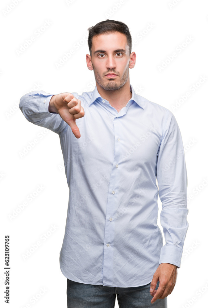 Handsome young businessman looking unhappy and angry showing rejection and negative with thumbs down gesture. Bad expression.