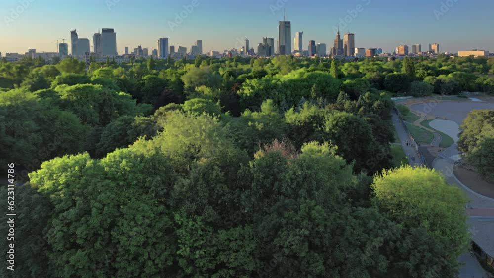 Aerial, drone panorama of Warsaw city during sunset. View from Pole Mokotowskie Park 