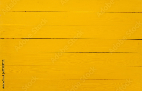 Bright yellow wooden planks background top view