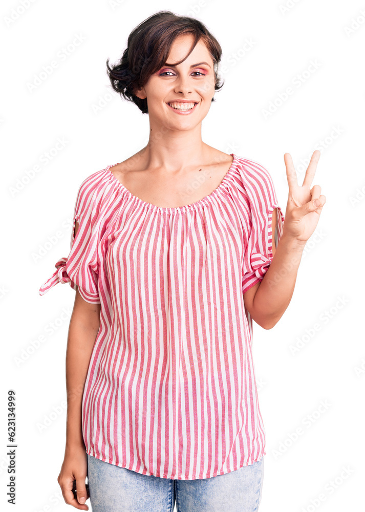 Beautiful young woman with short hair wearing casual summer clothes smiling looking to the camera showing fingers doing victory sign. number two. Beautiful young woman with short hair wearing casual summer clothes smiling looking to the camera showing fingers doing victory sign. number two.