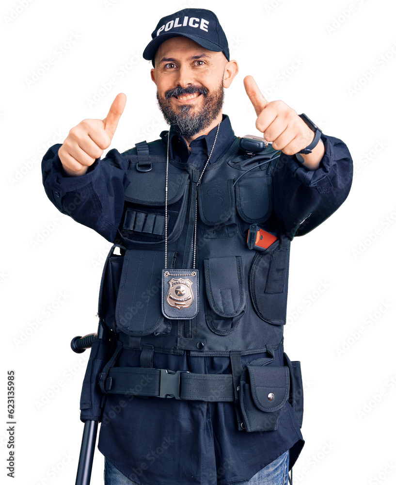 Young handsome man wearing police uniform approving doing positive gesture with hand, thumbs up smiling and happy for success. winner gesture. Young handsome man wearing police uniform approving doing positive gesture with hand, thumbs up smiling and happy for success. winner gesture.