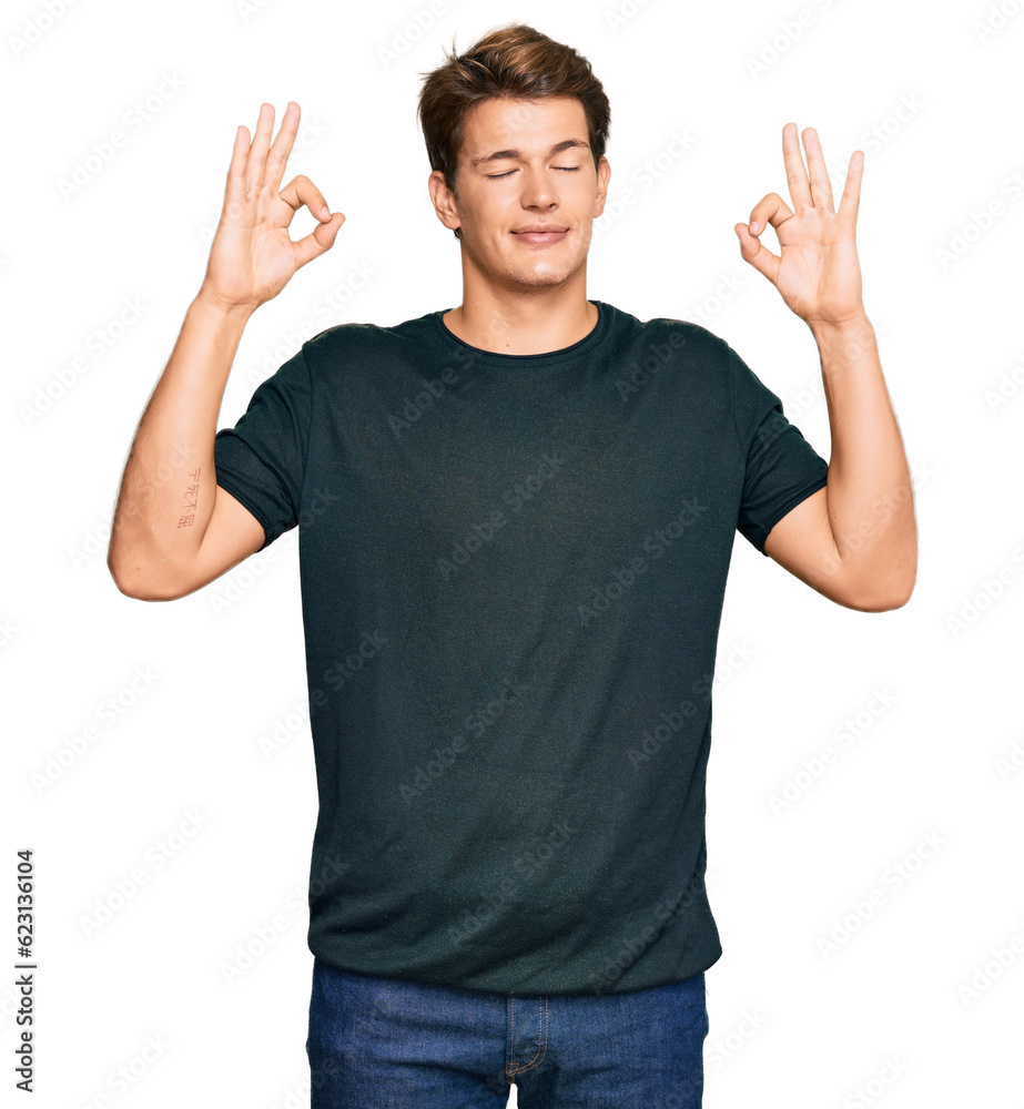 Handsome caucasian man wearing casual clothes relax and smiling with eyes closed doing meditation gesture with fingers. yoga concept. Handsome caucasian man wearing casual clothes relax and smiling with eyes closed doing meditation gesture with fingers. yoga concept.