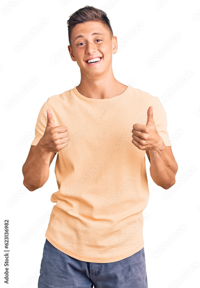 Young handsome man wearing casual clothes success sign doing positive gesture with hand, thumbs up smiling and happy. cheerful expression and winner gesture. Young handsome man wearing casual clothes success sign doing positive gesture with hand, thumbs up smiling and happy. cheerful expression and winner gesture.