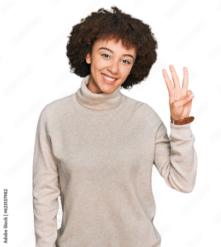 Young hispanic girl wearing wool winter sweater showing and pointing up with fingers number three while smiling confident and happy. Young hispanic girl wearing wool winter sweater showing and pointing up with fingers number three while smiling confident and happy.