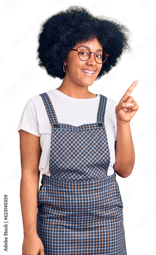 Young african american girl wearing casual clothes showing and pointing up with finger number one while smiling confident and happy. Young african american girl wearing casual clothes showing and pointing up with finger number one while smiling confident and happy.