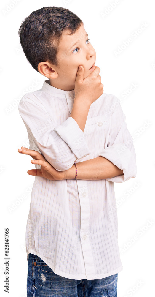 Cute blond kid wearing elegant shirt thinking worried about a question, concerned and nervous with hand on chin Cute blond kid wearing elegant shirt thinking worried about a question, concerned and nervous with hand on chin