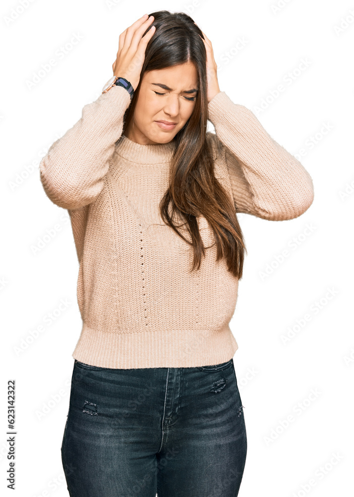 Φωτογραφία Young brunette woman wearing casual winter sweater suffering from headache desperate and stressed because pain and migraine